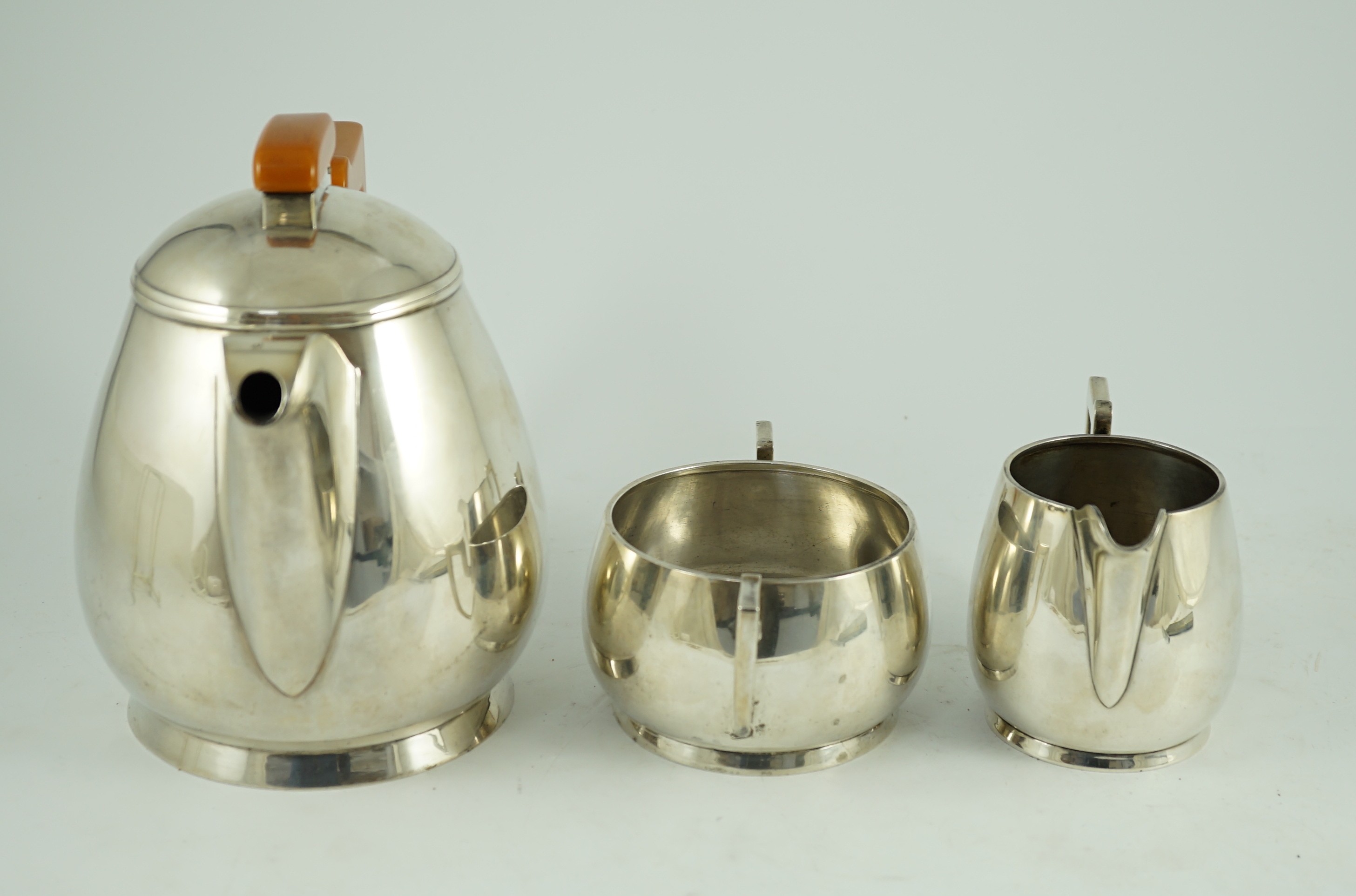 A stylish George VI silver three piece tea set, by Ls Sl